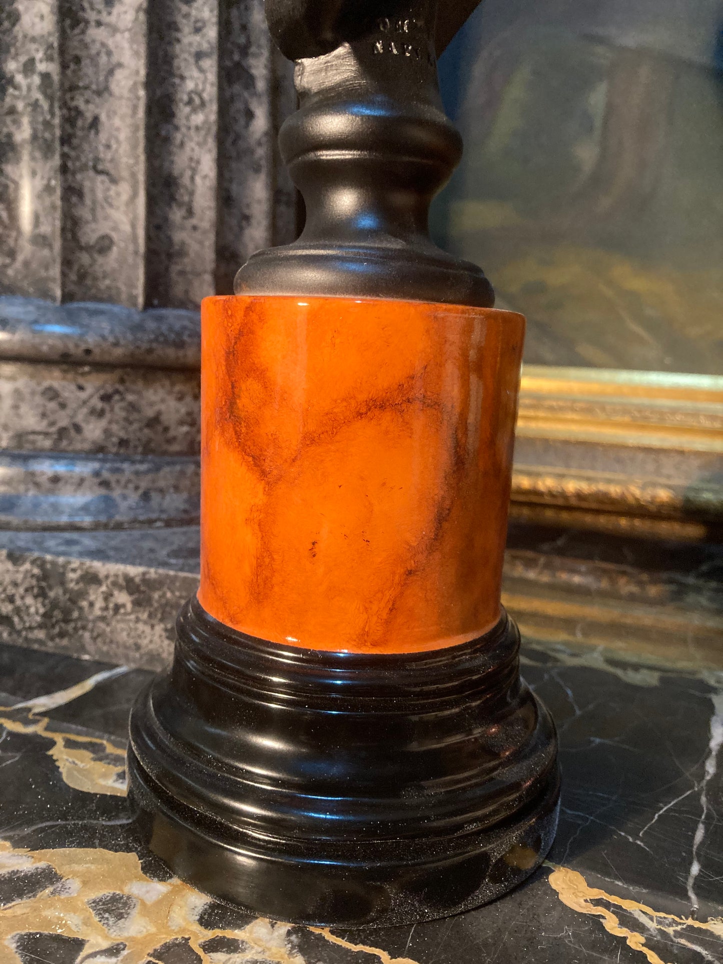 Plato in black on sienna base