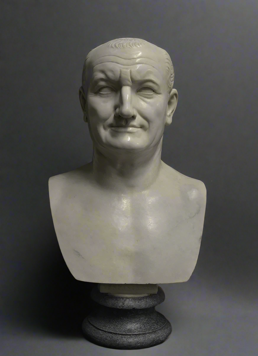 White marble bust of a Vespasian on a dark gray background