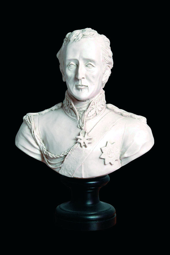 Marble bust of a man in military uniform, mounted on a black stand.