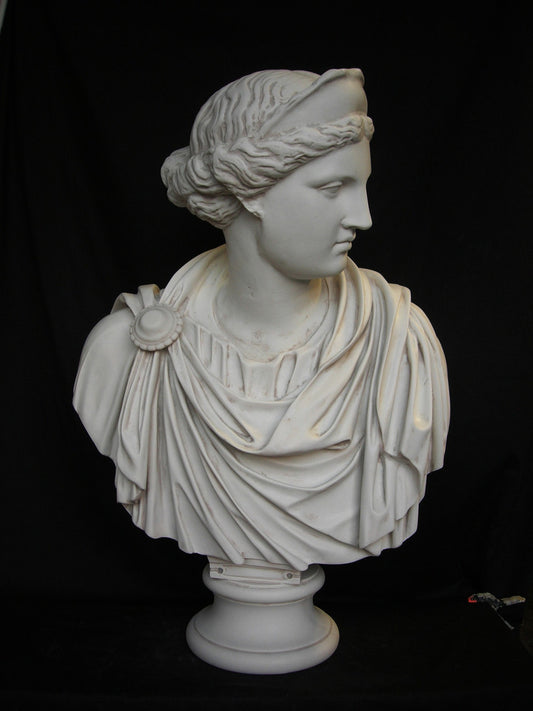 A white sculpture of a Roman empress wearing a toga and a tiara, seated against a black background.