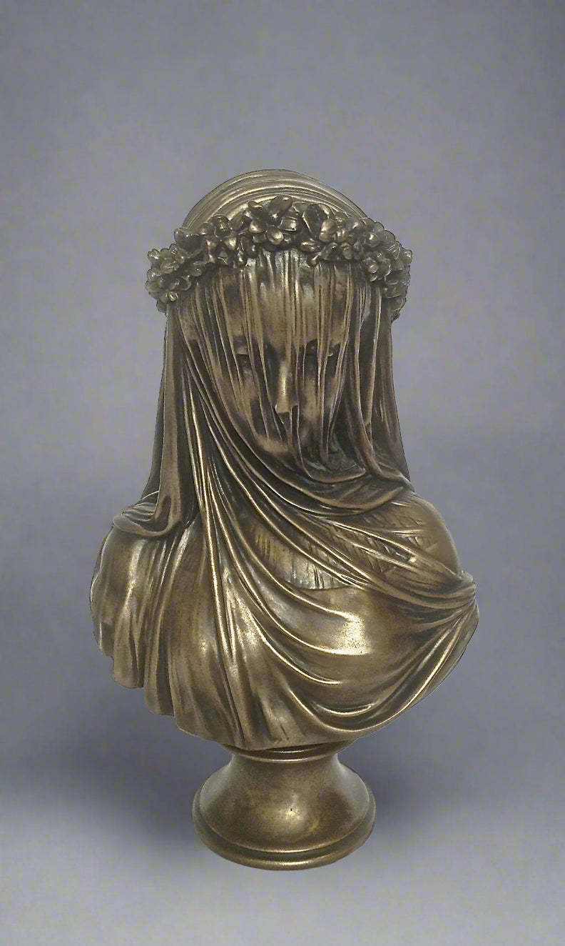 Bronze bust of a draped figure with floral crown on a gray background