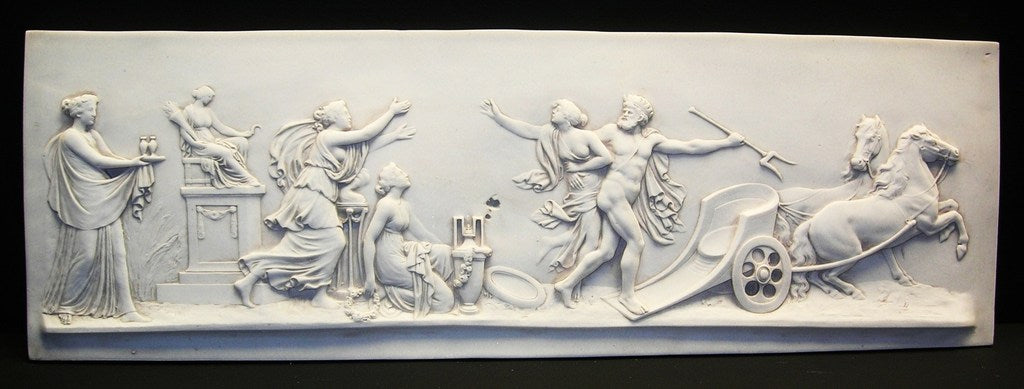 A white rectangular chariot plaque featuring a classical relief depiction of a mythological scene with multiple figures.