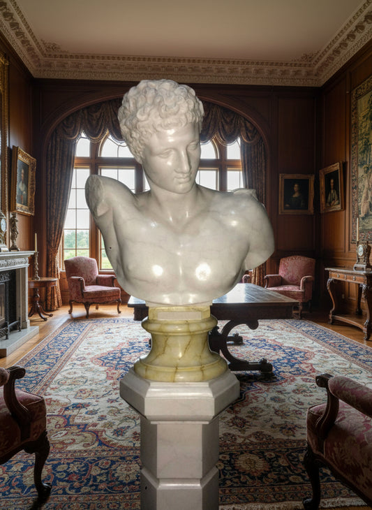 A photograph of a marble bust of Hermes, with a polished white marble body on a contrasting dark base, likely representing the神 Hermes from Greek mythology.