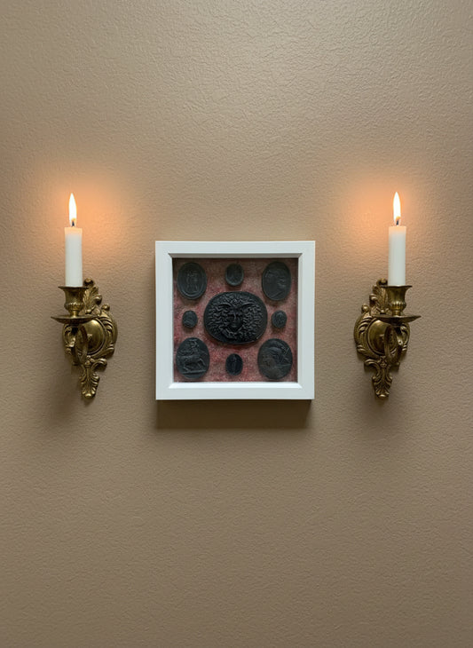 Intaglio Black Set In A White Frame.