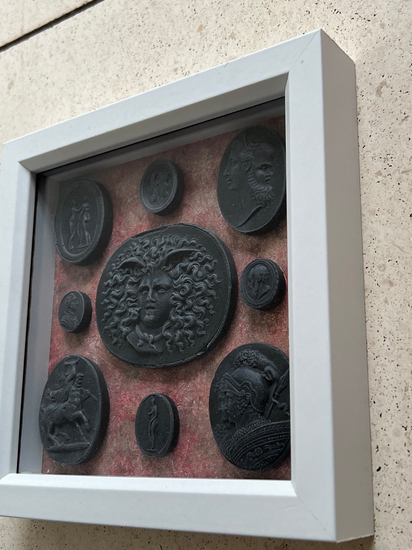 Intaglio Black Set In A White Frame.