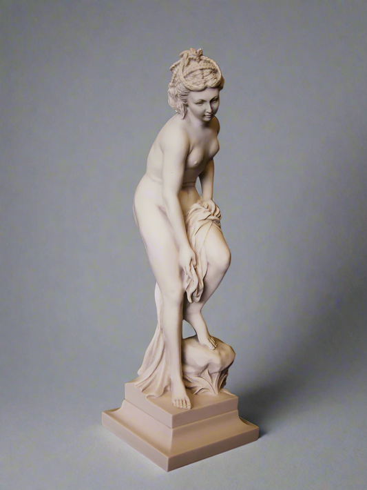 Statue of a woman on a gray background