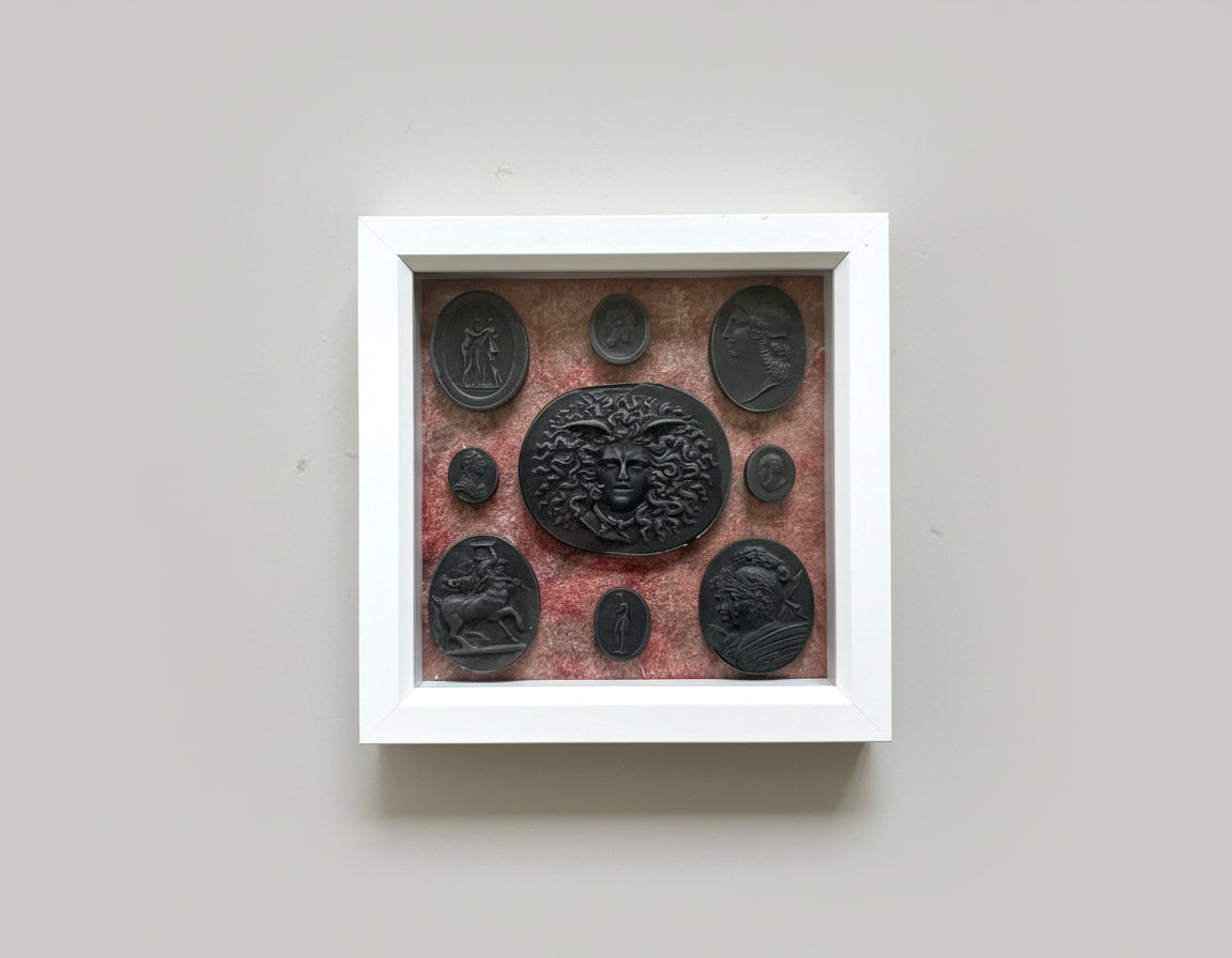 Intaglio Black Set In A White Frame.