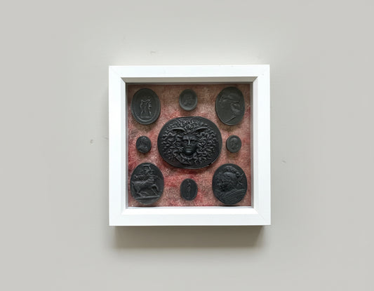 Intaglio Black Set In A White Frame.