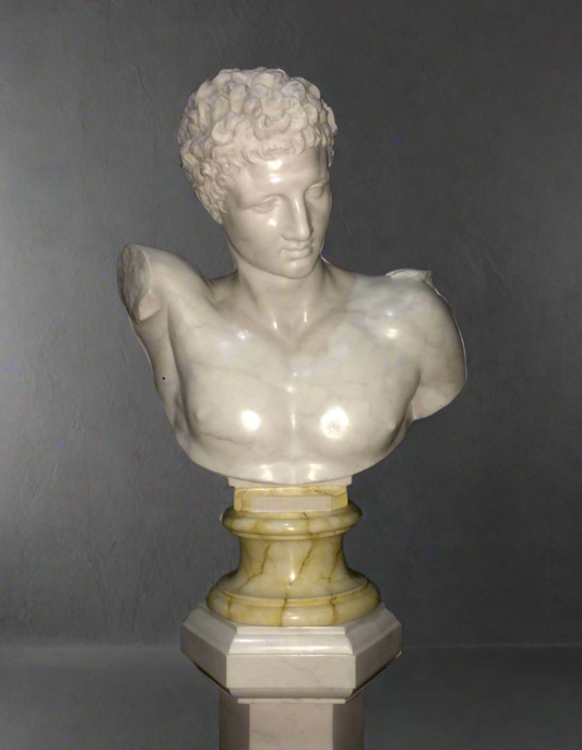 Marble bust of a classical Hermes figure on a gray background