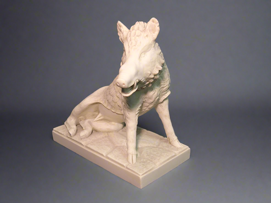 White stone sculpture of a dog on a gray background